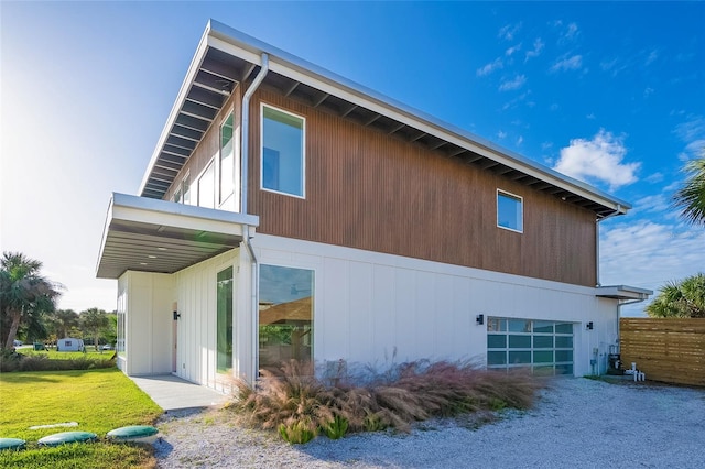 view of side of property with a garage