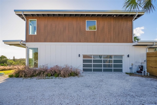 view of side of home featuring a garage