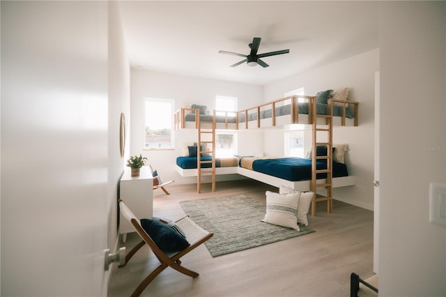 bedroom featuring light hardwood / wood-style flooring and ceiling fan