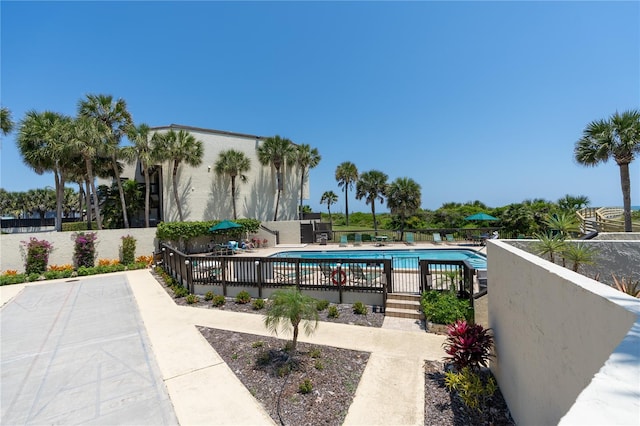 view of swimming pool featuring a patio area