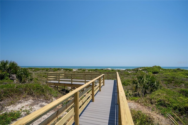 surrounding community featuring a water view