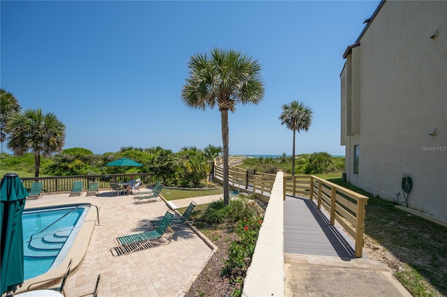 view of swimming pool with a patio area