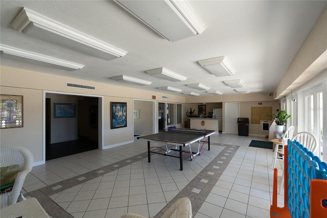 playroom with light tile patterned floors