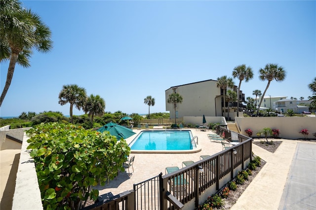 view of swimming pool with a patio