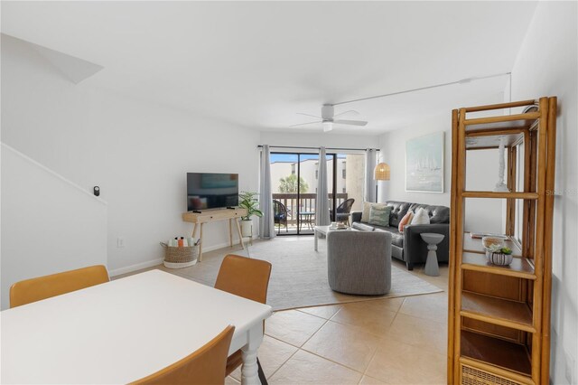 living room with light tile patterned floors and ceiling fan