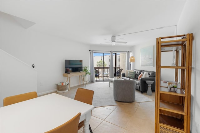 dining area with light tile patterned flooring and ceiling fan