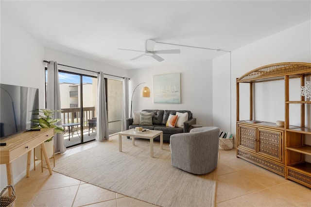 tiled living room featuring ceiling fan