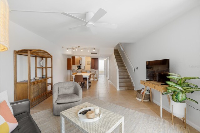 living room with ceiling fan and light tile patterned flooring