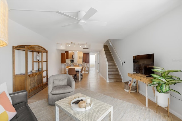 tiled living room featuring ceiling fan