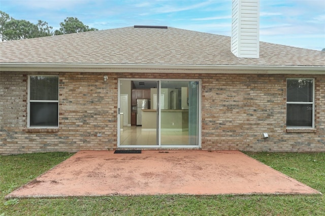 back of house featuring a patio area