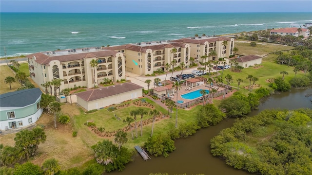 birds eye view of property with a water view