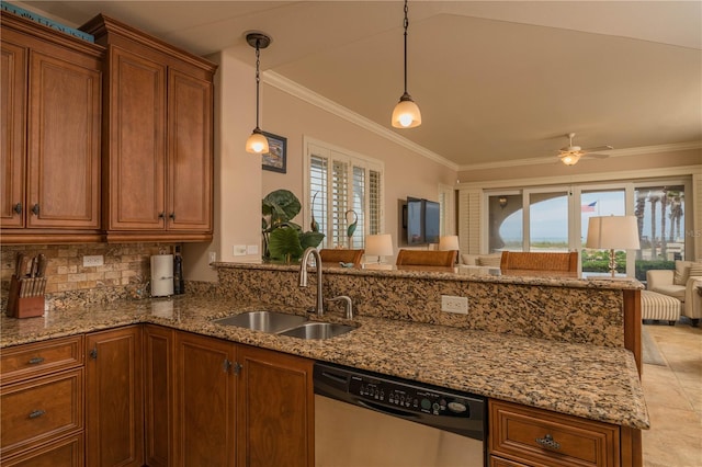 kitchen with hanging light fixtures, ceiling fan, light tile flooring, sink, and stainless steel dishwasher