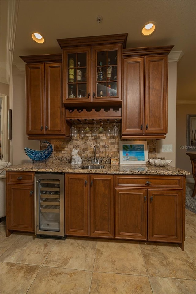 interior space with light tile flooring, crown molding, tasteful backsplash, and beverage cooler