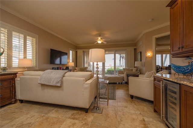 living room with ornamental molding, ceiling fan, light tile flooring, and beverage cooler