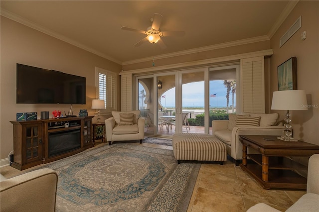 living room featuring a wealth of natural light, crown molding, ceiling fan, and light tile floors