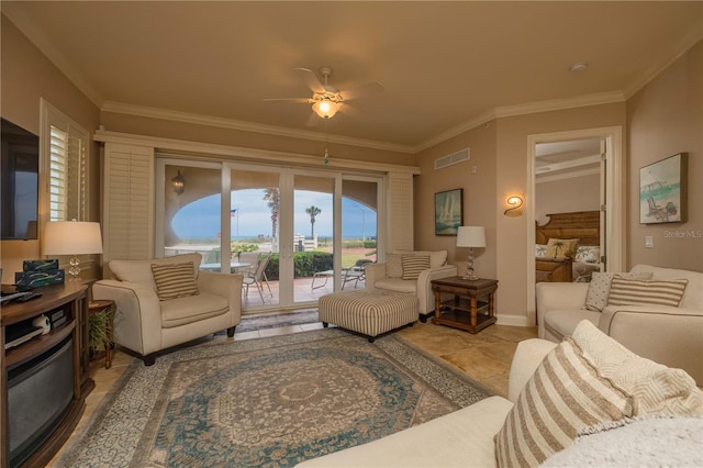 tiled living room with ceiling fan and crown molding