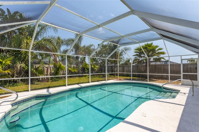 view of pool with a lanai and a patio area