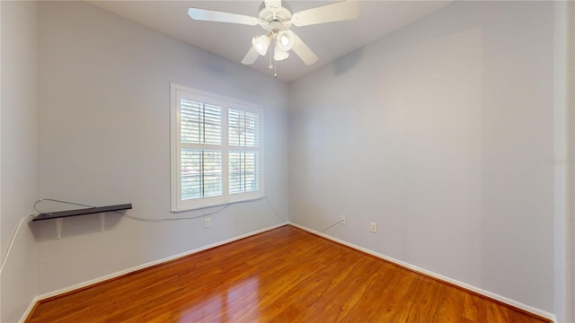 unfurnished room with wood-type flooring and ceiling fan