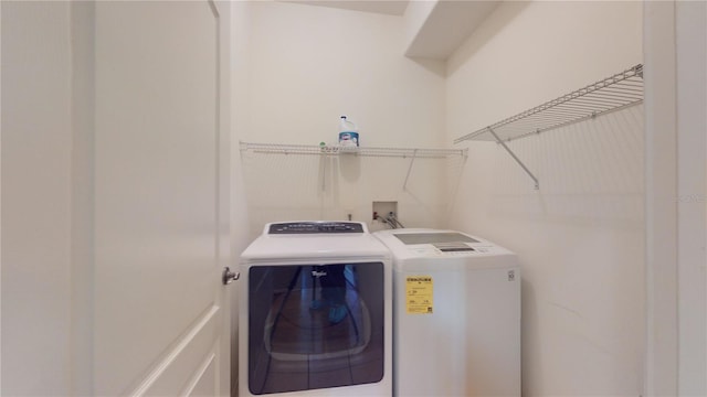 laundry room with washer and clothes dryer