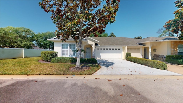 ranch-style home with a front lawn and a garage