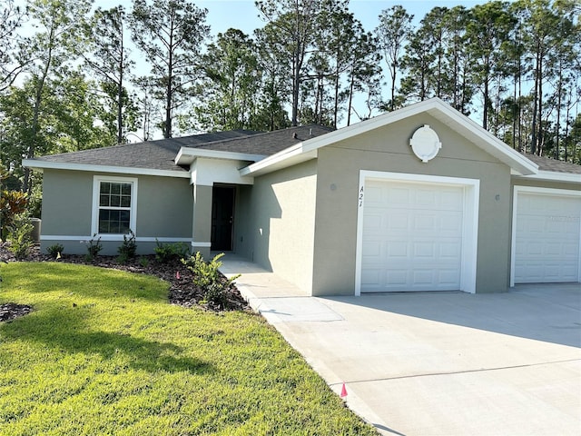 ranch-style home featuring a front lawn and a garage