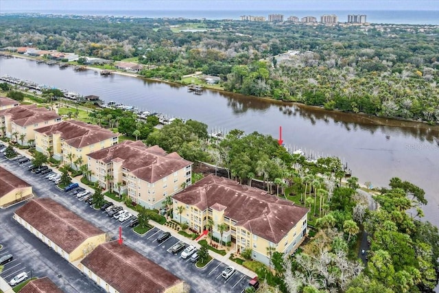 birds eye view of property featuring a water view