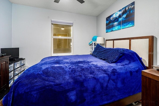 bedroom featuring a textured ceiling and ceiling fan