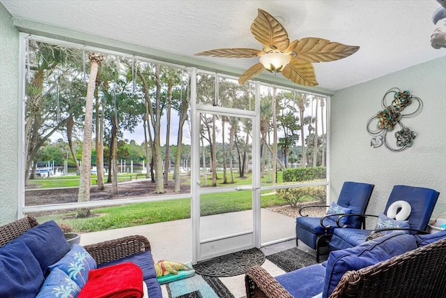 sunroom / solarium with ceiling fan