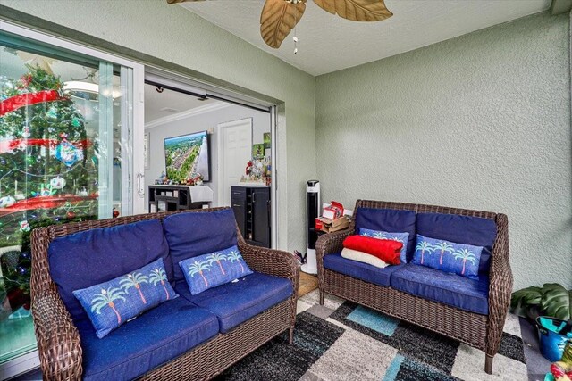 interior space featuring ceiling fan and a baseboard heating unit