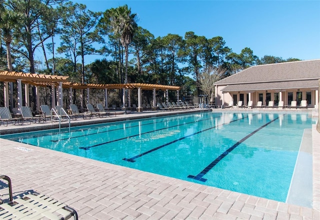 view of swimming pool with a pergola