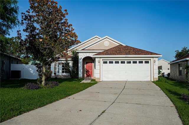 ranch-style home featuring a front lawn and a garage