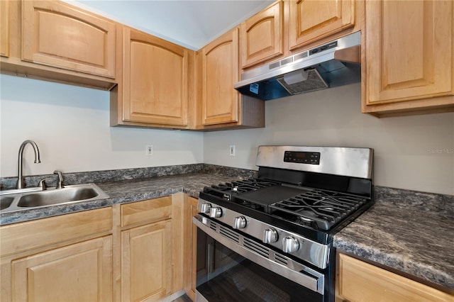 kitchen featuring light brown cabinetry, sink, and stainless steel range with gas cooktop