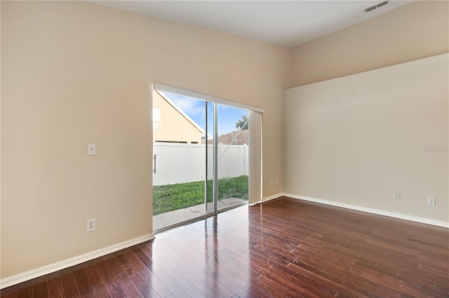 empty room featuring dark wood-type flooring