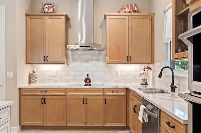 kitchen with sink, decorative backsplash, stainless steel dishwasher, and wall chimney exhaust hood