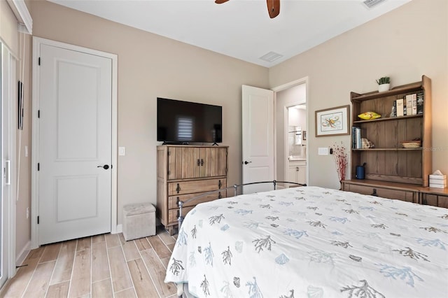 bedroom with ceiling fan and light hardwood / wood-style floors