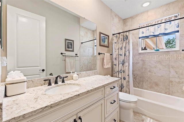 full bathroom featuring vanity, shower / tub combo with curtain, and toilet