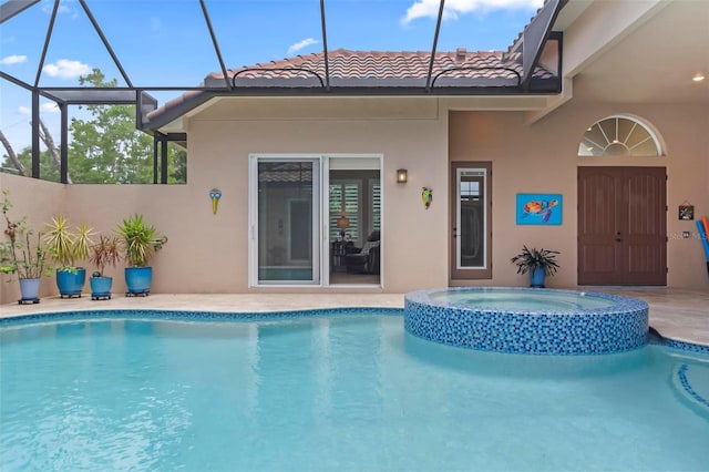 view of swimming pool featuring an in ground hot tub, a lanai, and a patio area