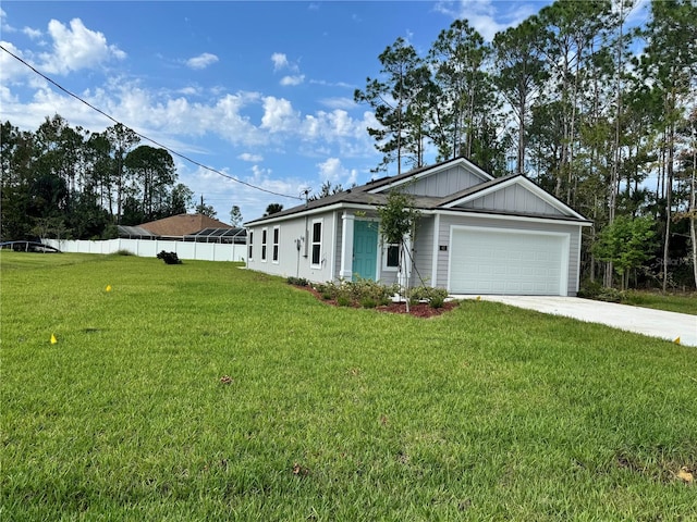 ranch-style home featuring a front yard, fence, concrete driveway, a garage, and board and batten siding