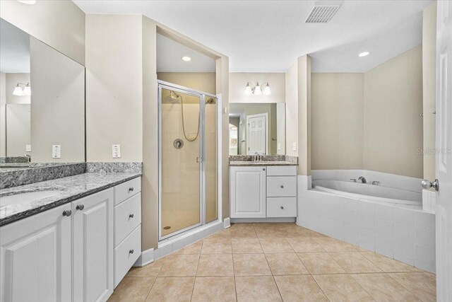 full bathroom with a sink, tile patterned flooring, and a shower stall