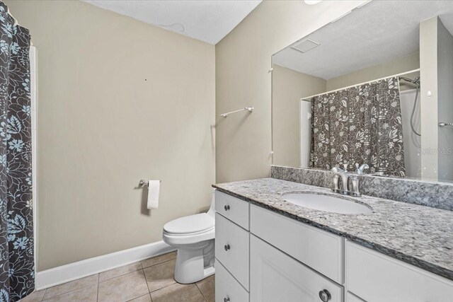 full bathroom featuring visible vents, baseboards, toilet, tile patterned floors, and vanity