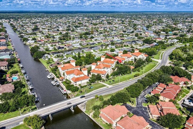 aerial view with a residential view and a water view