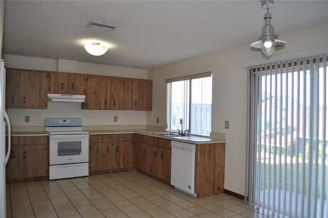 kitchen with ceiling fan, white appliances, light tile flooring, a textured ceiling, and sink