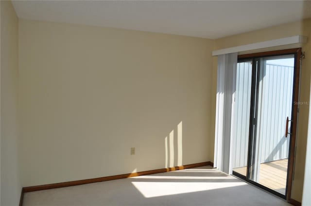 carpeted spare room with a healthy amount of sunlight