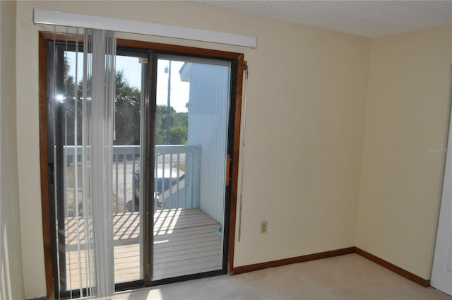 unfurnished room with a textured ceiling