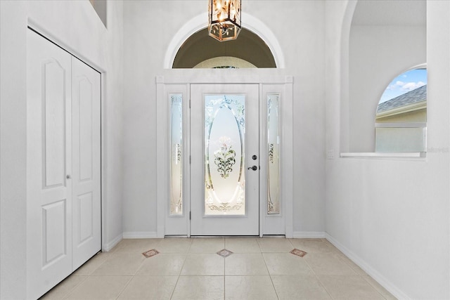 entryway with light tile patterned floors