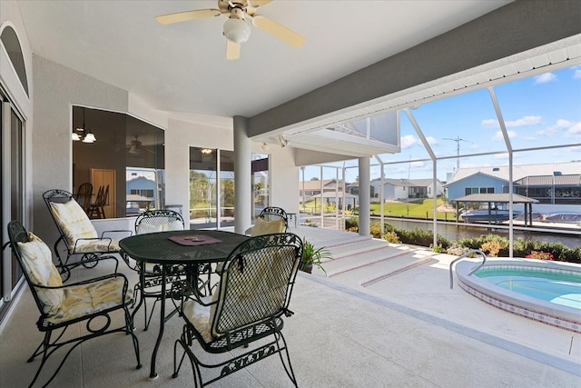 sunroom / solarium featuring a pool and ceiling fan