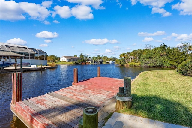 dock area featuring a yard and a water view