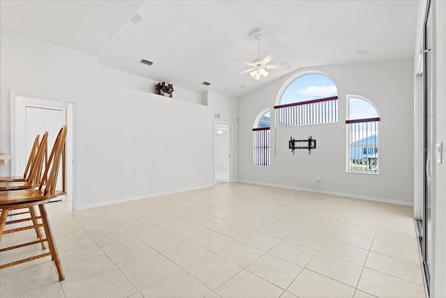 interior space featuring light tile patterned floors and ceiling fan