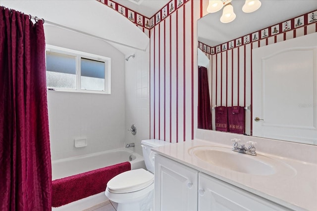 full bathroom featuring vanity, toilet, and shower / bathtub combination with curtain