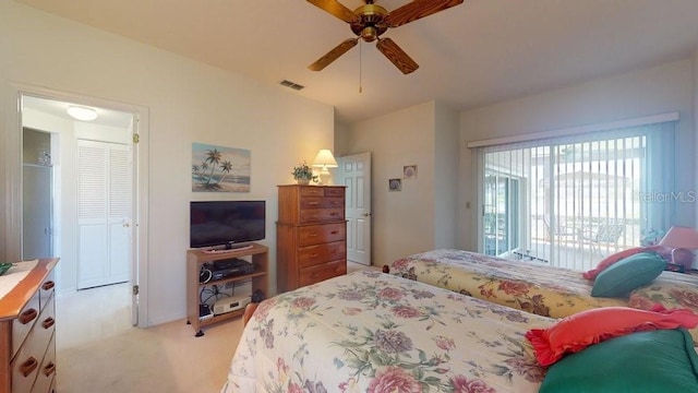 carpeted bedroom featuring ceiling fan and access to outside